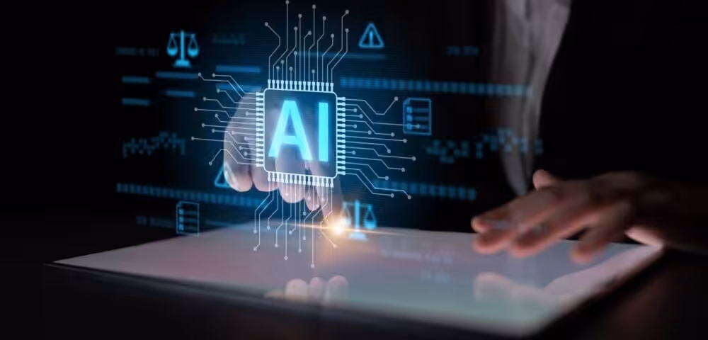 Holographic AI chip with blue circuitry hovering over a tablet, hands nearby in a dark setting.